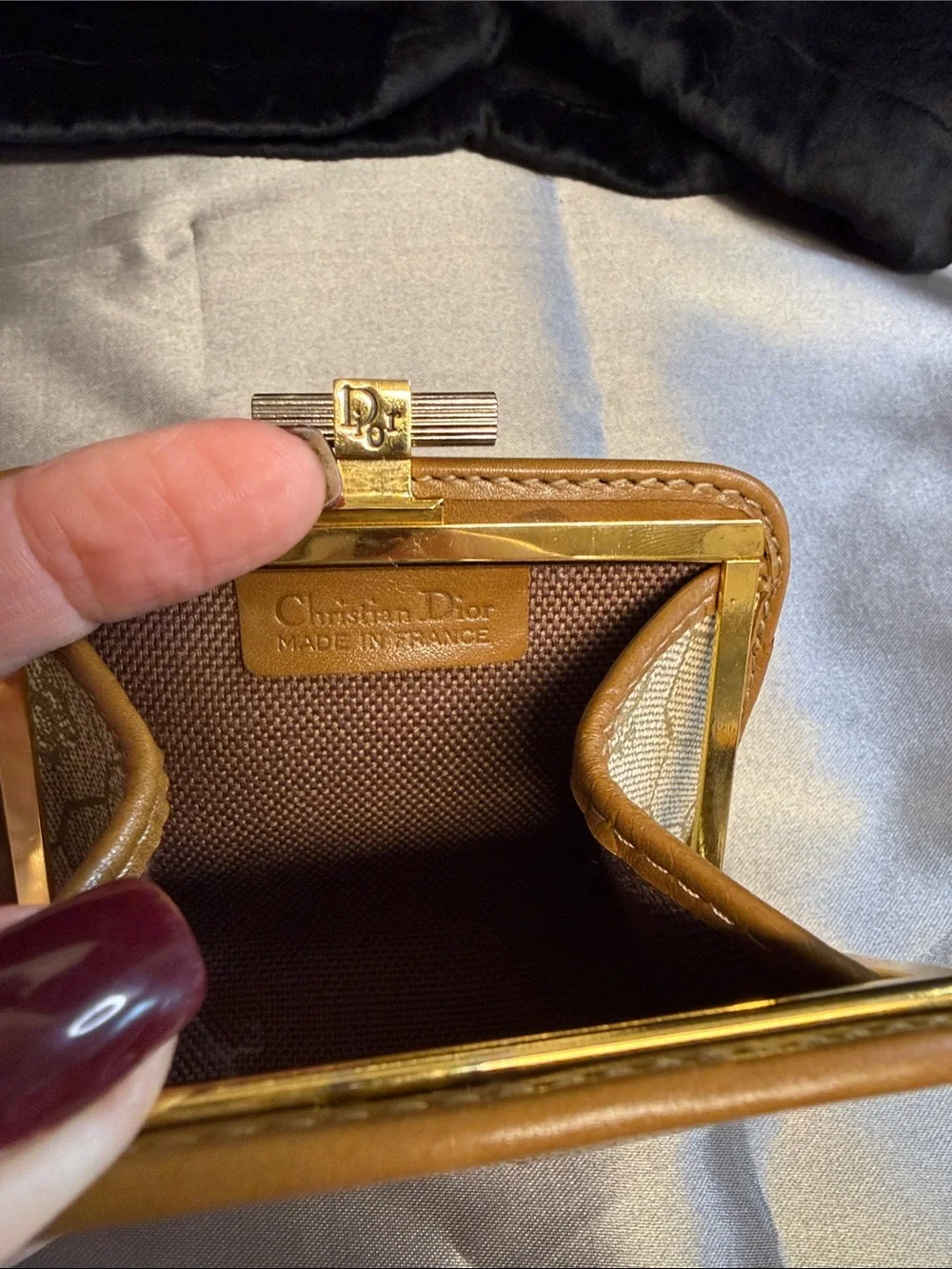 Dior honeycomb kiss lock coin purse.